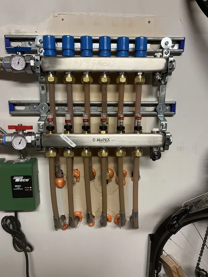 Plumber performing Water Heater Repair at a residential property in Vinton